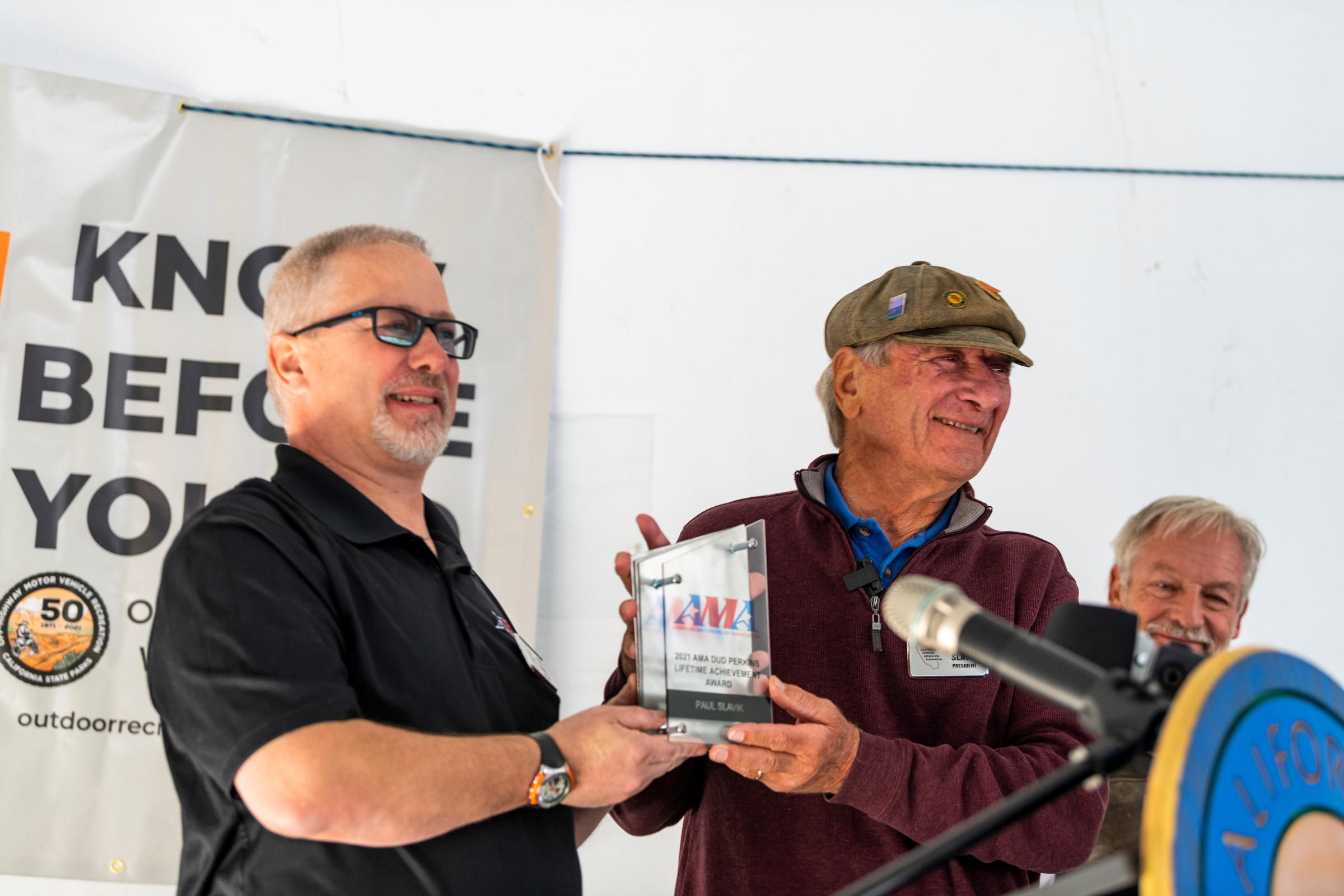 CORF's Paul Slavik receiving AMA's Dudley Perkins lifetime achievement award from Nick Haris